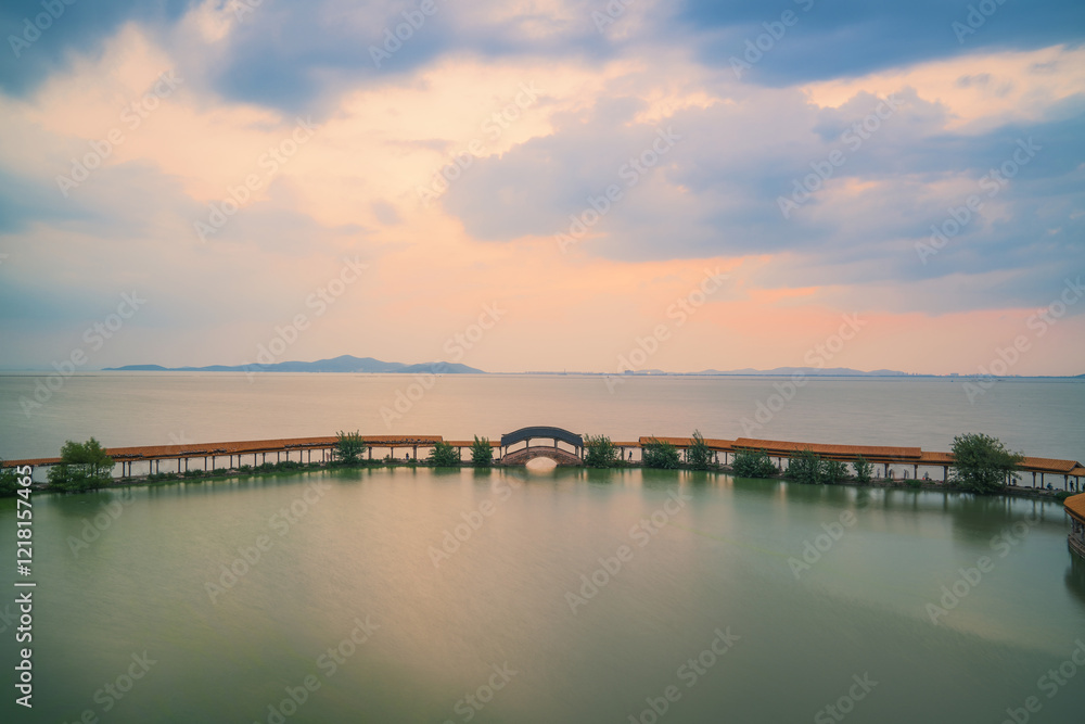 An ancient building complex and sunset scenery on the Taihu Lake Lake in Wuxi, Jiangsu Province, China will be on June 3, 2024 An ancient building complex and sunset scenery on the Taihu Lake Lake in Wuxi, Jiangsu Province, China will be on June 3, 2024
