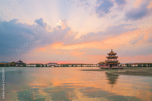 An ancient building complex and sunset scenery on the Taihu Lake Lake in Wuxi, Jiangsu Province, China will be on June 3, 2024 photo