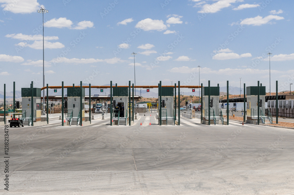 U.S.-Mexico border inspection lanes with automated systems and green-arrow signals at the Nogales-Mariposa Port of Entry customs checkpoint in Nogales, Arizona, ensuring efficient vehicle processing U.S.-Mexico border inspection lanes with automated systems and green-arrow signals at the Nogales-Mariposa Port of Entry customs checkpoint in Nogales, Arizona, ensuring efficient vehicle processing