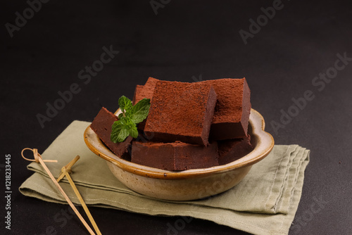 Sweet Potatoes Nama Chocolate Garnish with Mint Leaf. photo