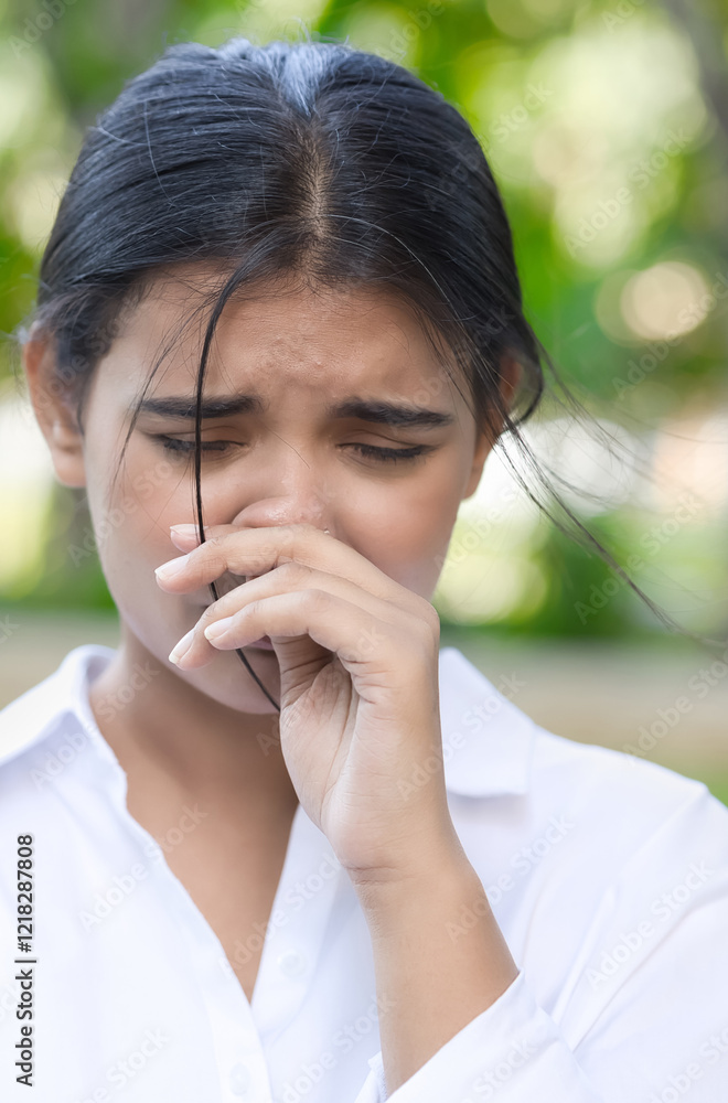 Allergic sick South Asian or Indian woman having runny nose, nose stiffness, stiff nose with snot, nasal mucus due to cold or flu, air dust pollution allergy, health care and allergy concept image Allergic sick South Asian or Indian woman having runny nose, nose stiffness, stiff nose with snot, nasal mucus due to cold or flu, air dust pollution allergy, health care and allergy concept image
