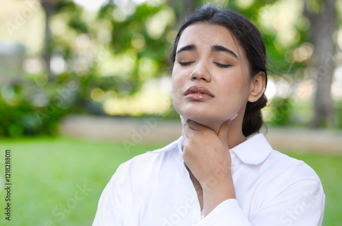 Allergic ill south asian Indian woman getting sick and having sore throat, coughing, air pollution allergy or choking with sickness or flu inflammatory infection