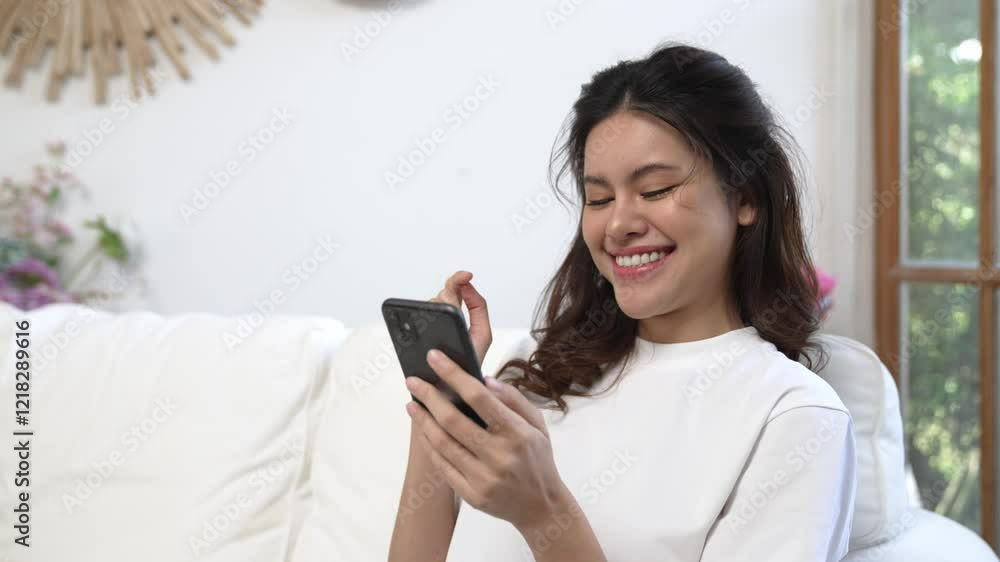 Young woman using smartphone browsing for online shopping E commerce by online payment gateway at vivancy home. Modern and convenience online purchasing make secure and convenient purchases. Young woman using smartphone browsing for online shopping E commerce by online payment gateway at vivancy home. Modern and convenience online purchasing make secure and convenient purchases.