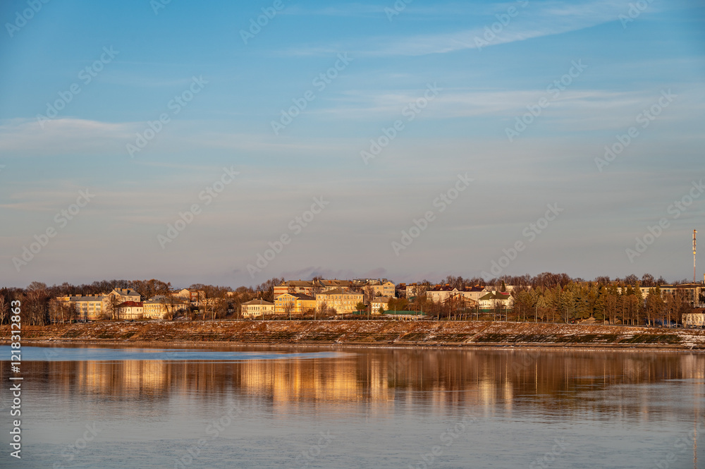 Aerial view of a small provincial town on the banks of the river at sunset. Aerial view of a small provincial town on the banks of the river at sunset.