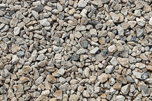 Crushed limestone rocks forming a textured surface, ideal for construction and landscaping