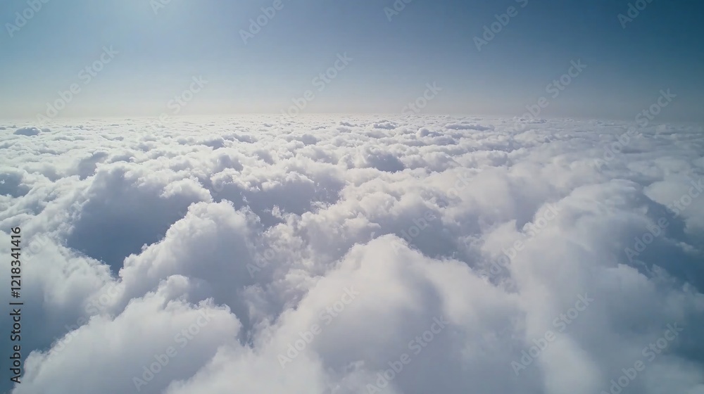 Fototapeta premium Aerial view of fluffy white clouds against a clear blue sky