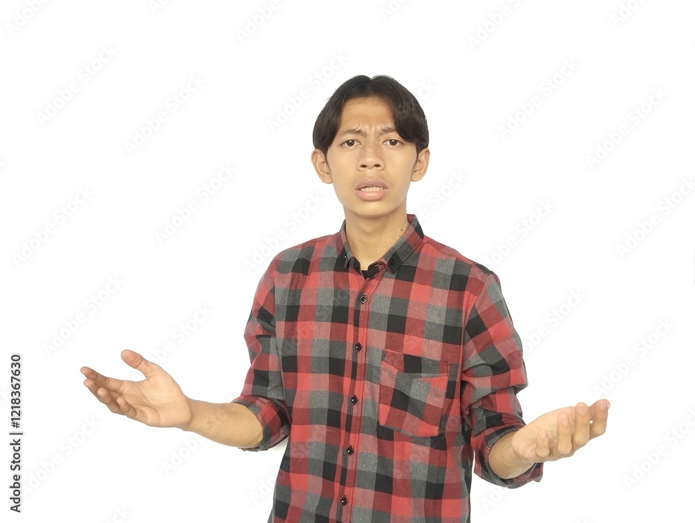 Young Asian man showing surprised facial expression with both hands raised Young Asian man showing surprised facial expression with both hands raised