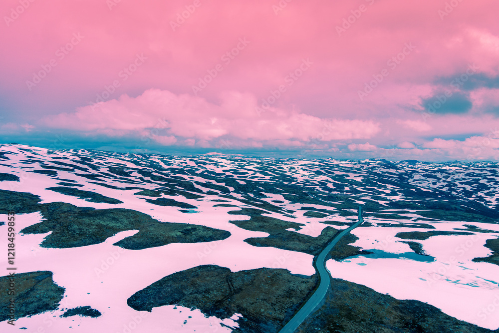 Aerial view of snow-covered mountain in spring. High mountain road Bjorgavegen. Aurlandsvegen, Aurland, Norway