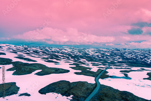 Aerial view of snow-covered mountain in spring. High mountain road Bjorgavegen. Aurlandsvegen, Aurland, Norway photo