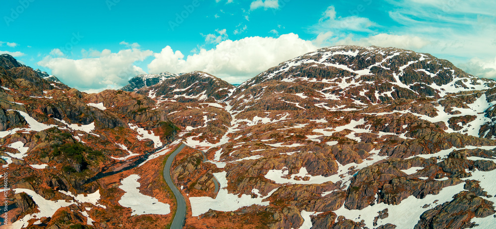 Aerial view of a snow-covered mountain in spring. High mountain road Bjorgavegen. Aurlandsvegen, Aurland, Norway