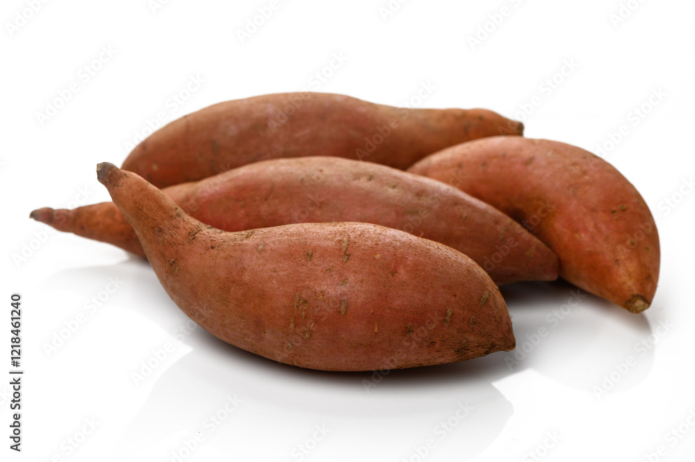 Freshly harvested sweet potatoes sitting on a clean white surface ready for culinary adventures Freshly harvested sweet potatoes sitting on a clean white surface ready for culinary adventures