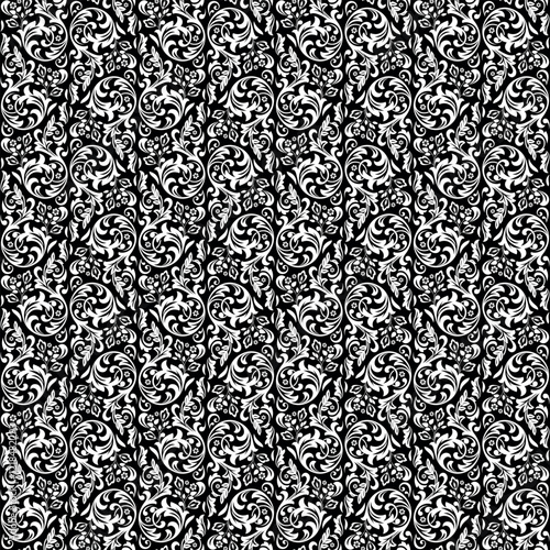 Wallpaper in the style of Baroque. Seamless vector background. White and black floral ornament. Graphic pattern for fabric, wallpaper, packaging. Ornate Damask flower ornament.