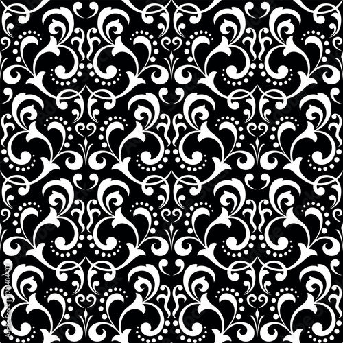Wallpaper in the style of Baroque. Seamless vector background. White and black floral ornament. Graphic pattern for fabric, wallpaper, packaging. Ornate Damask flower ornament.