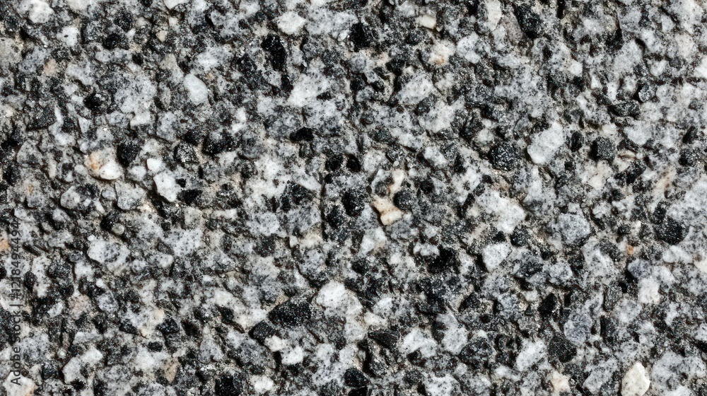 Textured grey gravel surface closeup, outdoor, background blur Textured grey gravel surface closeup, outdoor, background blur