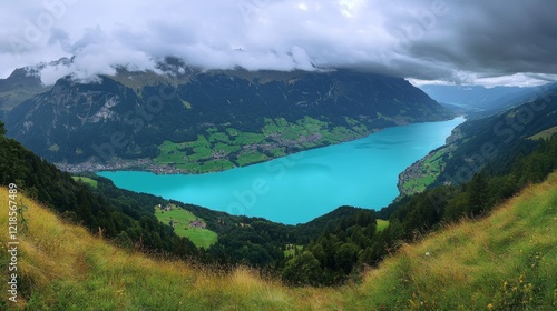 The beautiful mountain lake in the Bern canton of Switzerland is called Brienz. It has crystal-clear turquoise water that surrounds the village of Iseltwald.