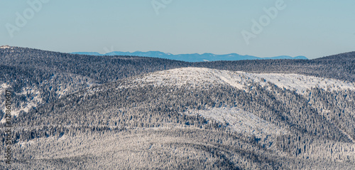 Nearer Cervena hora and Vozka hill and Gory Walbrzyskie, Gory Kamienne and Rudawy Janowickie mountains from Praded hill in Jeseniky mountains in Czech republic photo