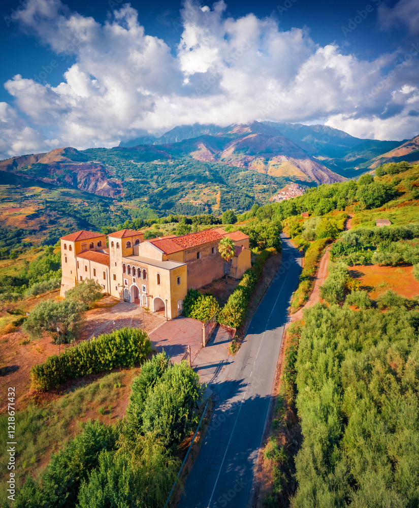 Vertical summer view from flying drone of typical Italian church, Bonifati village location, Province of Cosenza. Stunning morning scene of mountains in Italy, Europe. Traveling concept background.