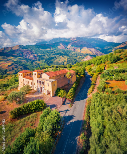 Obraz na płótnie Vertical summer view from flying drone of typical Italian church, Bonifati village location, Province of Cosenza. Stunning morning scene of mountains in Italy, Europe. Traveling concept background. w salonie