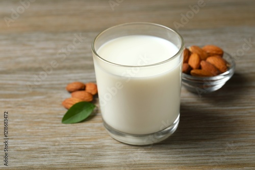 Glass of almond milk on the table  photo