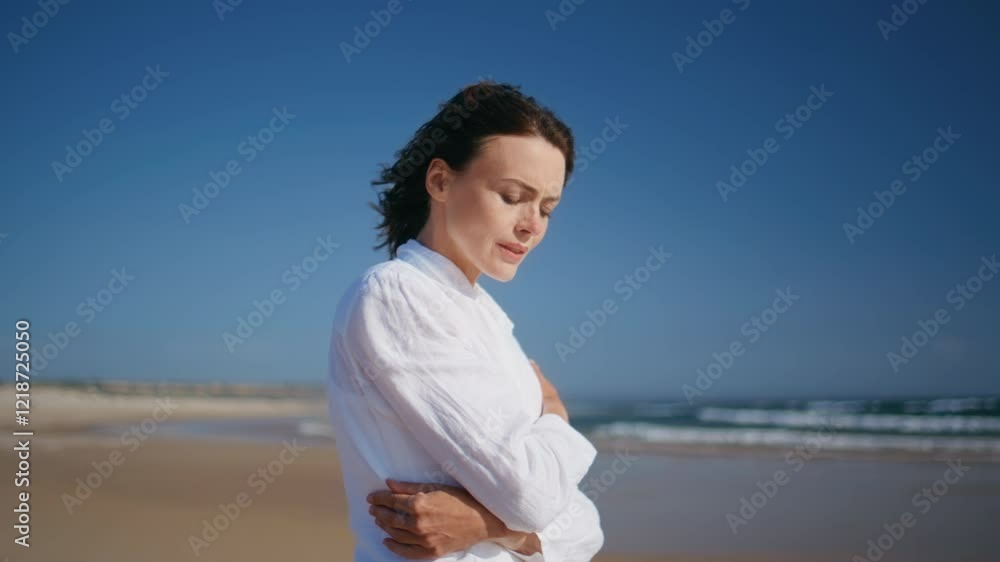 Pensive lady walking sea coast spending weekend on gold sandy beach closeup. Pensive lady walking sea coast spending weekend on gold sandy beach closeup.