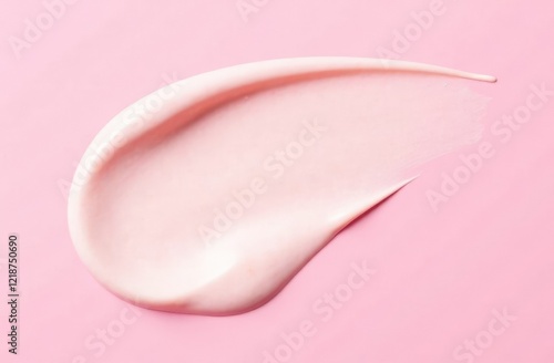 Skincare cream smear on pink background. Cosmetic lotion swatch texture of face cream, body moisturiser and hair conditioner. Beauty and cosmetic product.