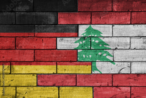 colourful painted big flag of germany and flag of lebanon on a massive old brick wall background. concept photo