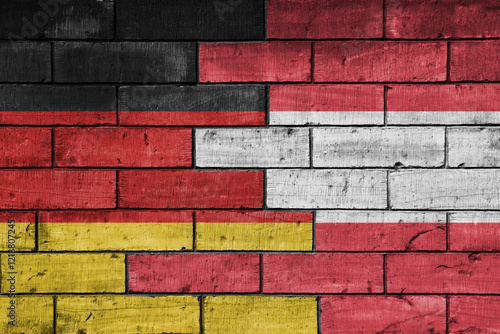 Photography colourful painted big flag of germany and flag of austria on a massive old brick wall background