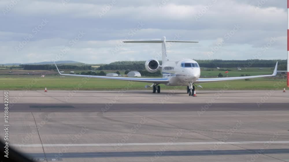 high end business jet parked airport viewed from inside another airplane through passenger window luxury sophistication private aviation shot video perspective aircraft travel high end business jet parked airport viewed from inside another airplane through passenger window luxury sophistication private aviation shot video perspective aircraft travel