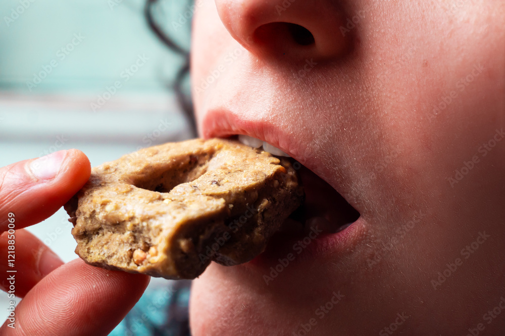 Girl biting tarallo puglia italy closeup. Traditional healthy homemade rustic authentic food. Girl biting tarallo puglia italy closeup. Traditional healthy homemade rustic authentic food.