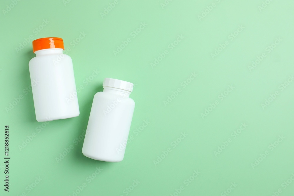 White bottles on a green background White bottles on a green background