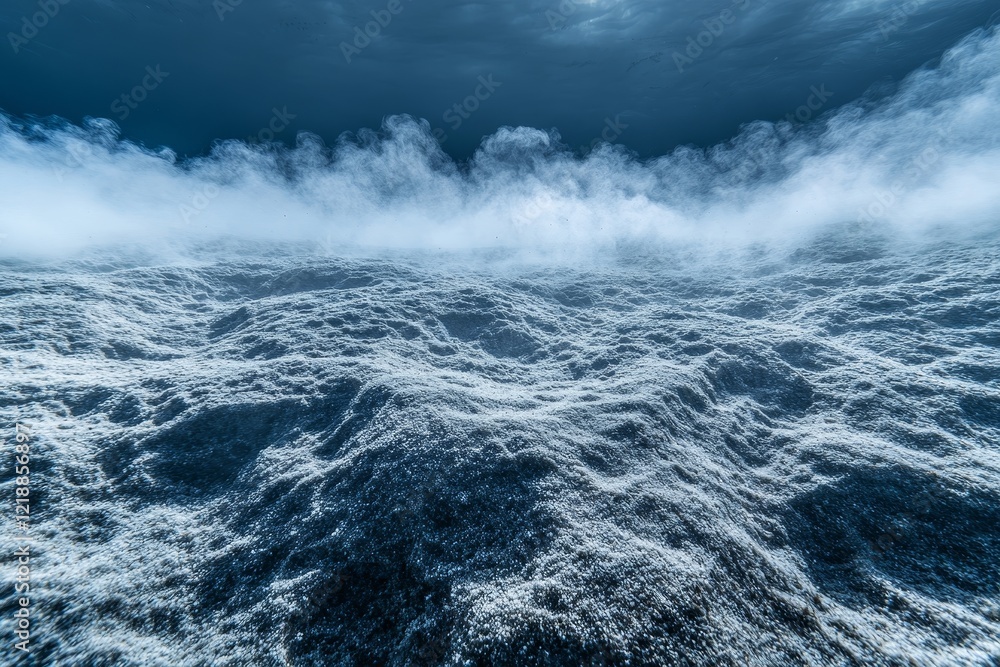Fototapeta premium Underwater scene of the ocean floor with bubbles and small fish amidst misty blue waters