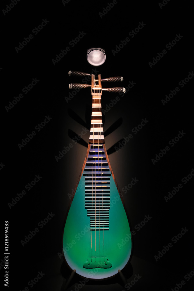 Pipa, old Chinese musical instrument. Black background Pipa, old Chinese musical instrument. Black background