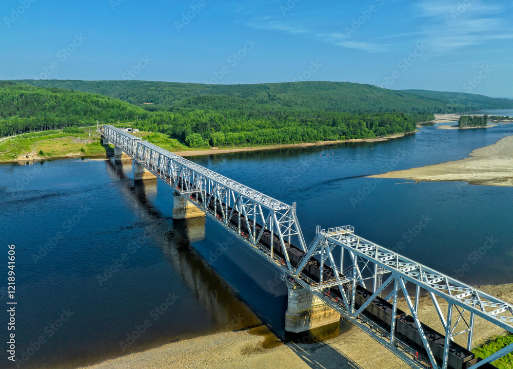 Train traffic. Railway bridge and trains with wagons. Transportation industry	
