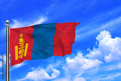 Mongolian National Flag Waving Proudly Under Blue Skies photo