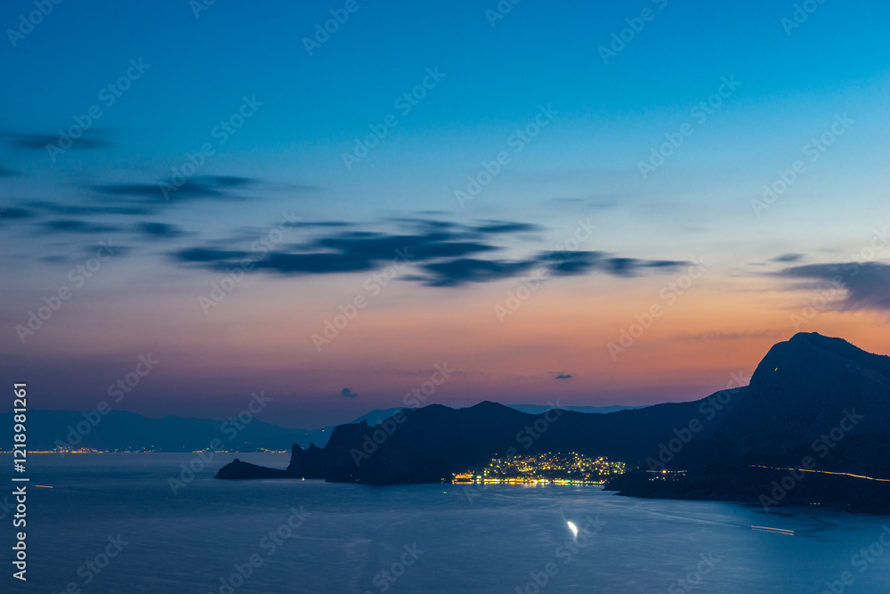 Fototapeta premium Picturesque evening view of Mount Sokol and the southern coast of the Crimean peninsula. Russia