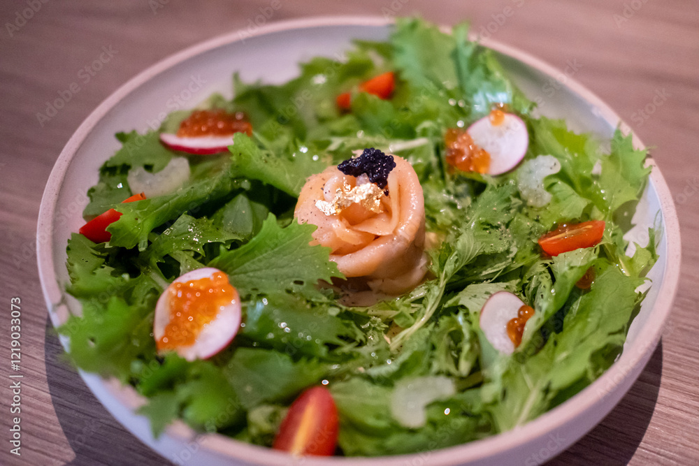 Parma salad with caviar and ikura, a dish combining savory Parma ham, delicate fish roe, and fresh greens Parma salad with caviar and ikura, a dish combining savory Parma ham, delicate fish roe, and fresh greens
