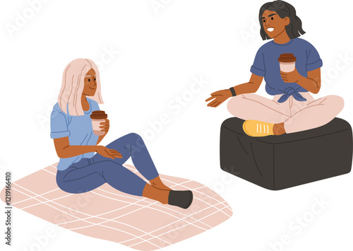 Two diverse young female friends holding disposable coffee cups talking and smiling while sitting on a blanket and a pouf, enjoying their free time, isolated on white background