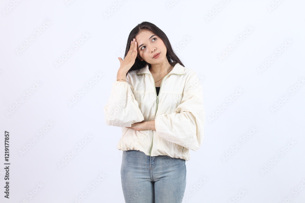 Thoughtful Adult Asian Woman in Casual Outfit Expressing Wonder Thoughtful Adult Asian Woman in Casual Outfit Expressing Wonder