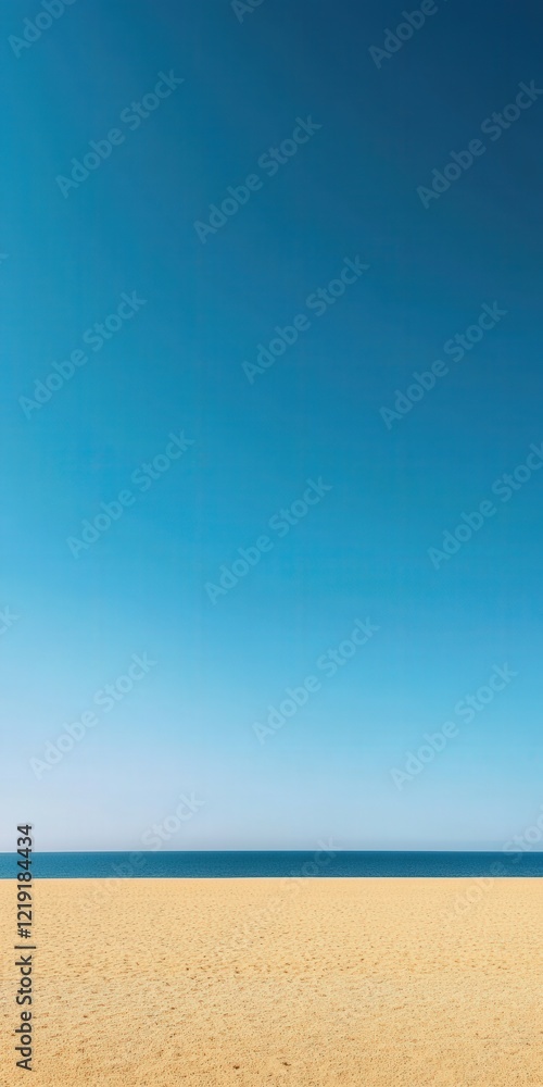 Fototapeta premium Calm beach with clear blue sky and gentle waves