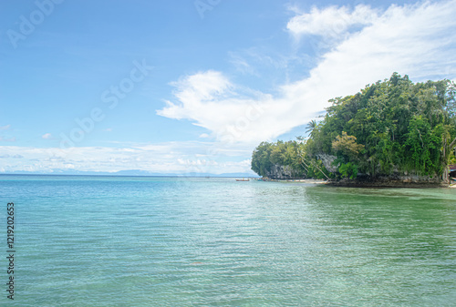 Beautiful beach with high rock cliffs