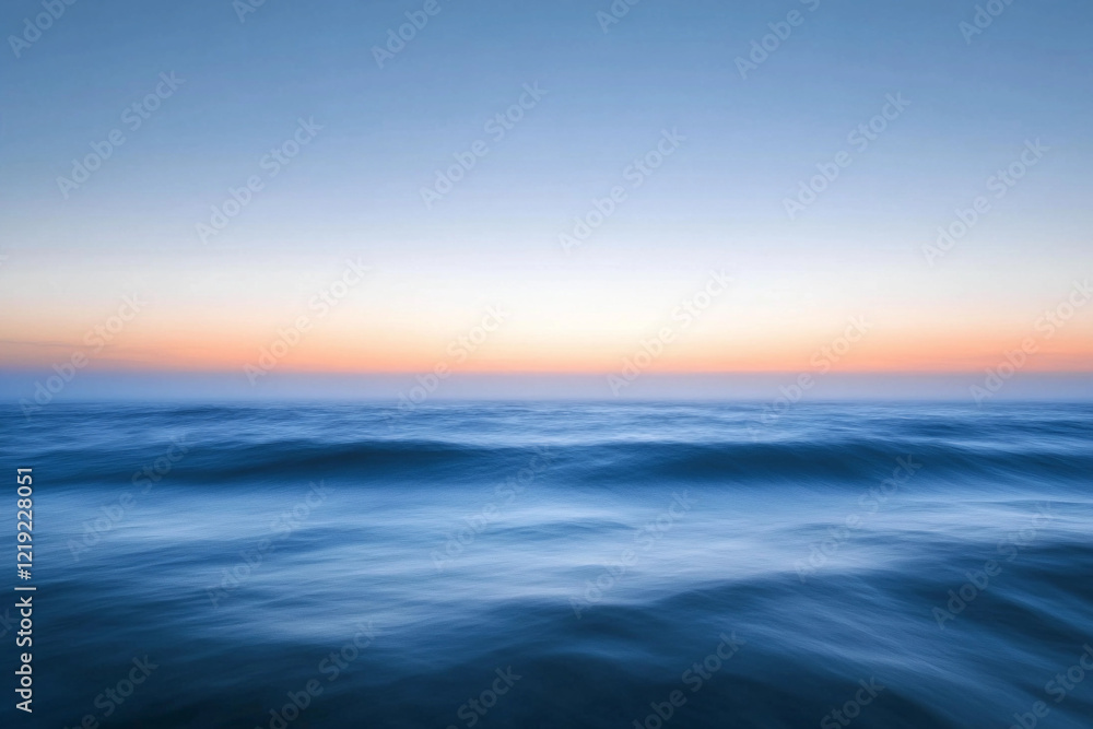Sunset over calm ocean waters creates a serene atmosphere with vibrant colors on the horizon Sunset over calm ocean waters creates a serene atmosphere with vibrant colors on the horizon