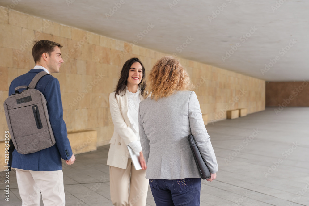 Fototapeta premium Businesspeople meeting and discussing under city archway