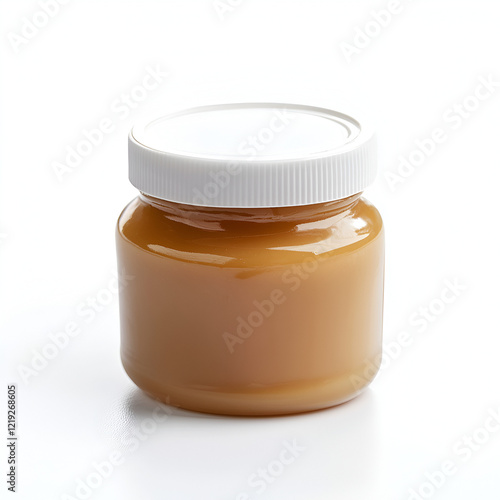 A jar of golden, creamy spread sits on a white background. Perfect for your food packaging or recipe designs.