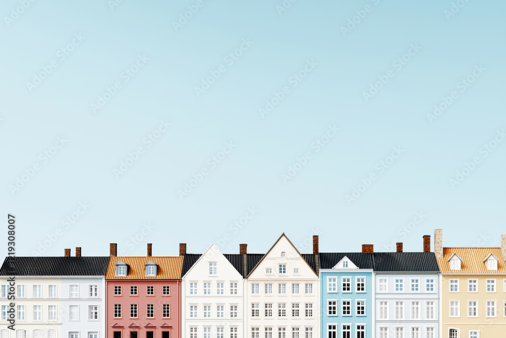 Fototapeta premium Colorful row of buildings against clear blue sky, showcasing architectural diversity and charm