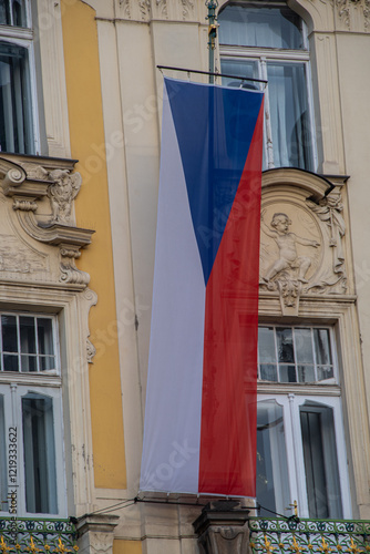 Obraz na płótnie The Czech national flag hangs on a balcony w salonie