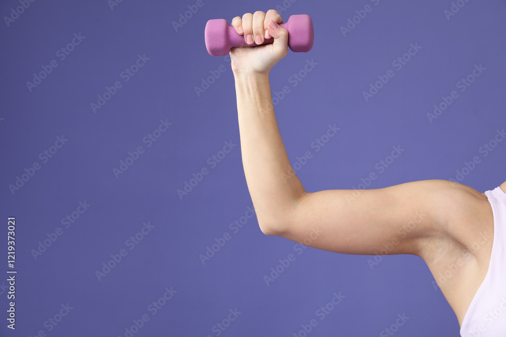 Woman exercising with dumbbell on purple background, closeup. Space for text Woman exercising with dumbbell on purple background, closeup. Space for text