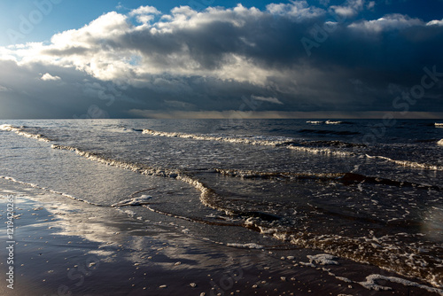 beautiful waves crashing against the seashore, windy day on the rocky shore of Vidzeme, Baltic Sea photo