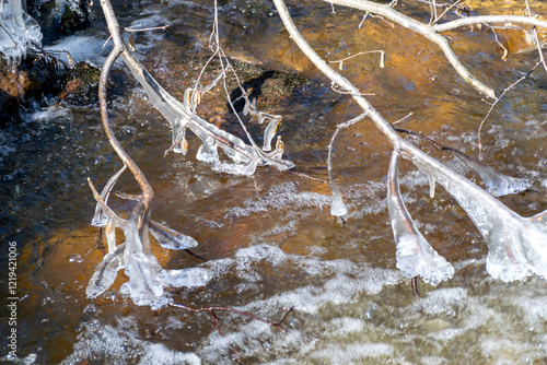 ice formations in a wild river, beautiful frozen ice formations from the interaction of water, flow and frost, Raunis, Latvia photo