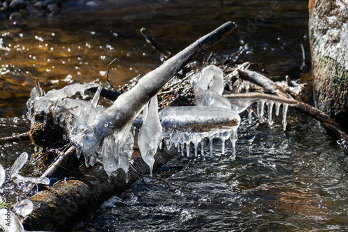 ice formations in a wild river, beautiful frozen ice formations from the interaction of water, flow and frost, Raunis, Latvia photo