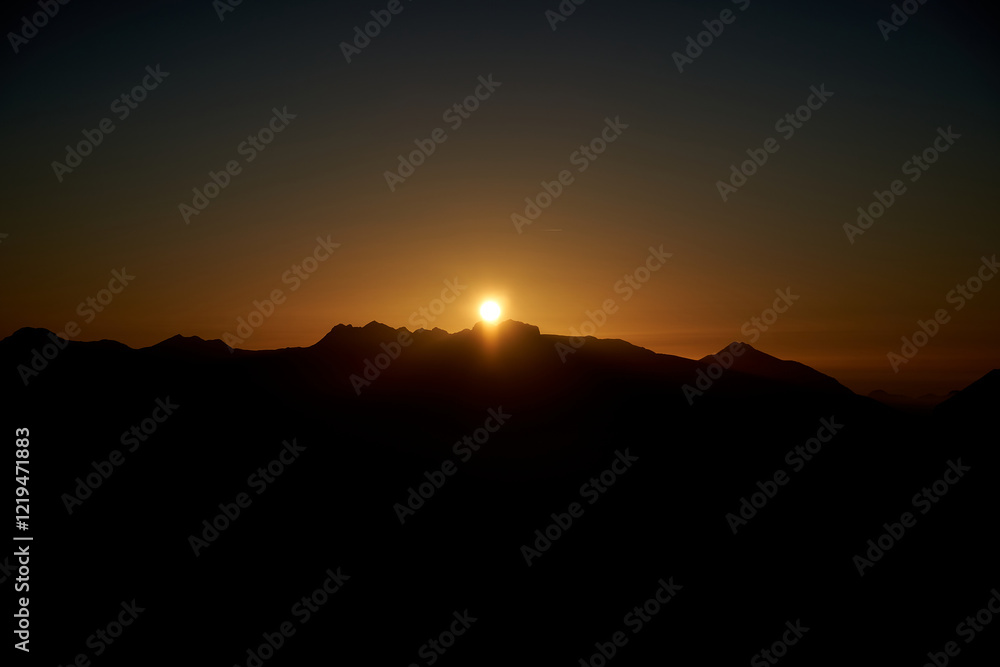 Landscape with sunset in the moutains which are sharply cut by the backlight of the sunset Landscape with sunset in the moutains which are sharply cut by the backlight of the sunset